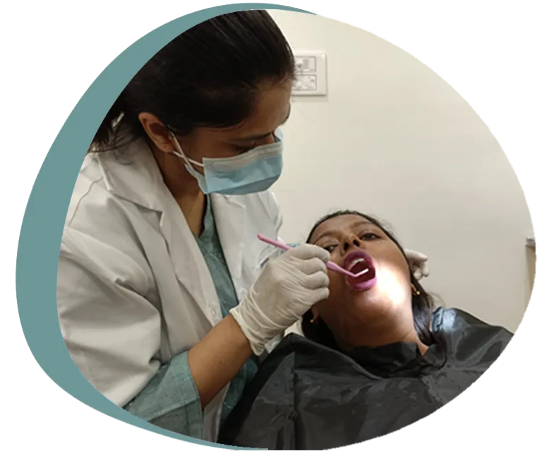 Happy patient smiling after treatment at The Tusk Dental Clinic, Kasba