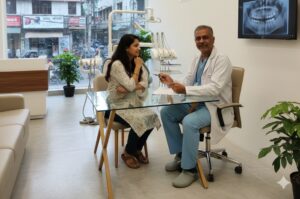 Modern dental clinic in Kasba Kolkata with experienced dentist consulting a patient.